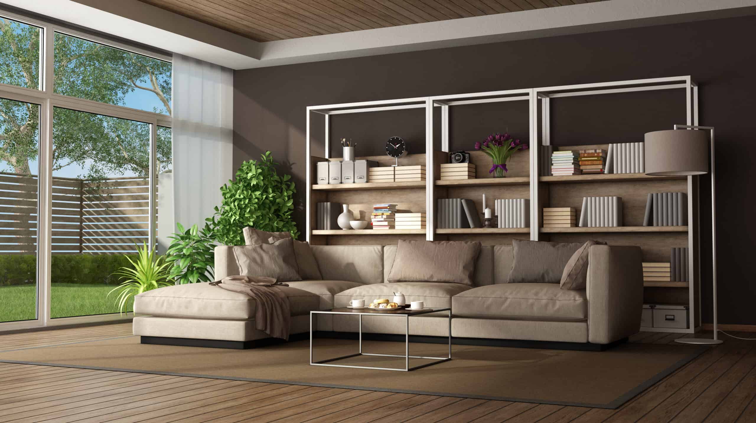 Bright living room with large windows and modern furniture for home expansion.