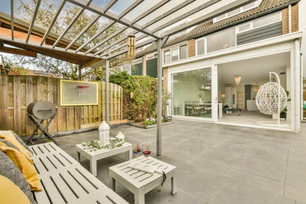 Modern outdoor patio with seating area and landscaping design