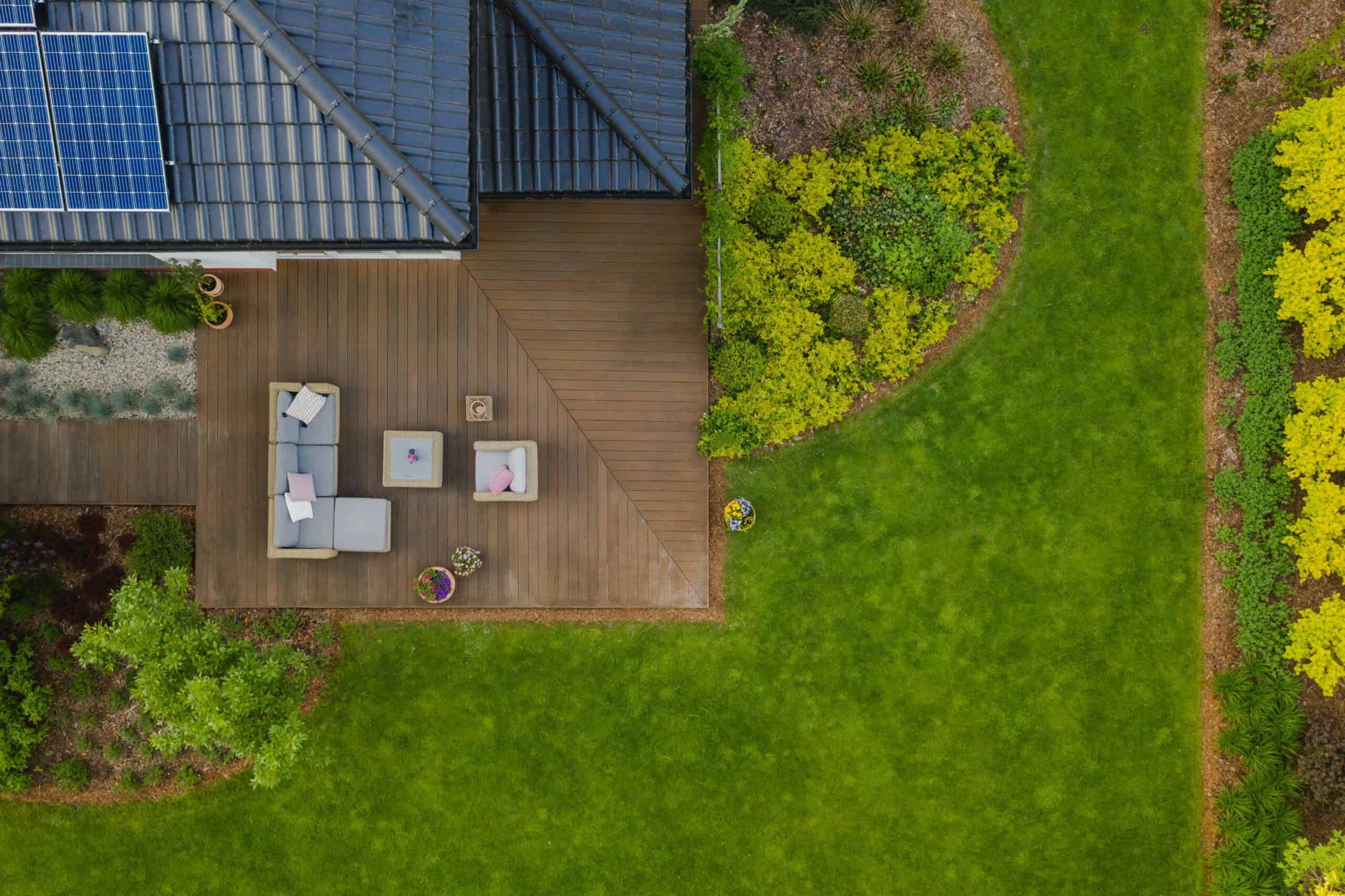 Custom hardscaping project by a local backyard contractor, with a multi-level paver patio and a built-in fire pit for entertaining.