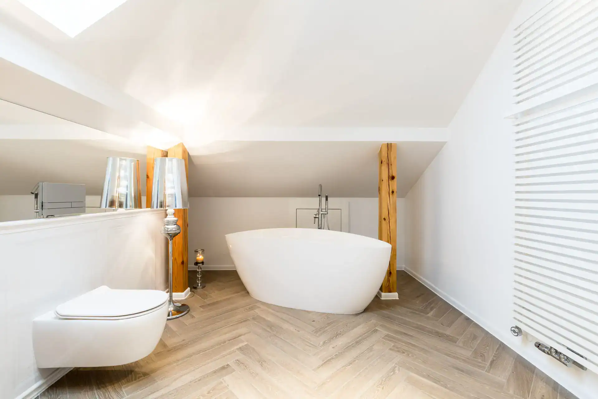 Attic bathroom remodel with freestanding bathtub
