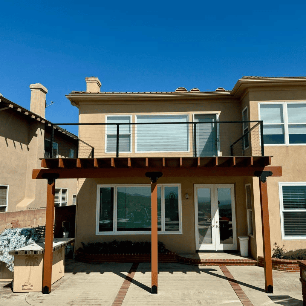 Outdoor balcony with pergola construction for enhanced outdoor living.