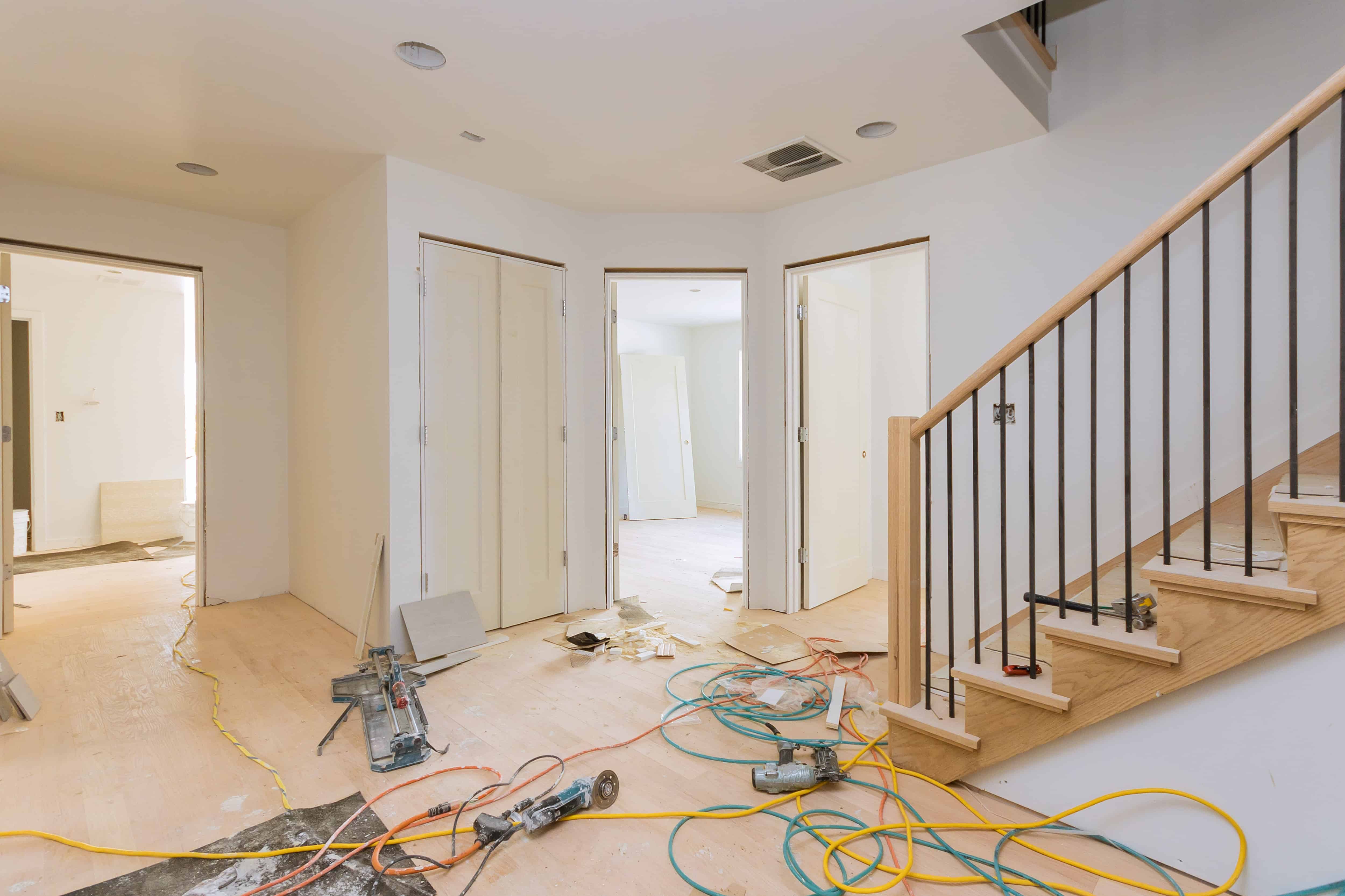 Newly constructed interior showcasing flooring and staircase by Tixan Construction.