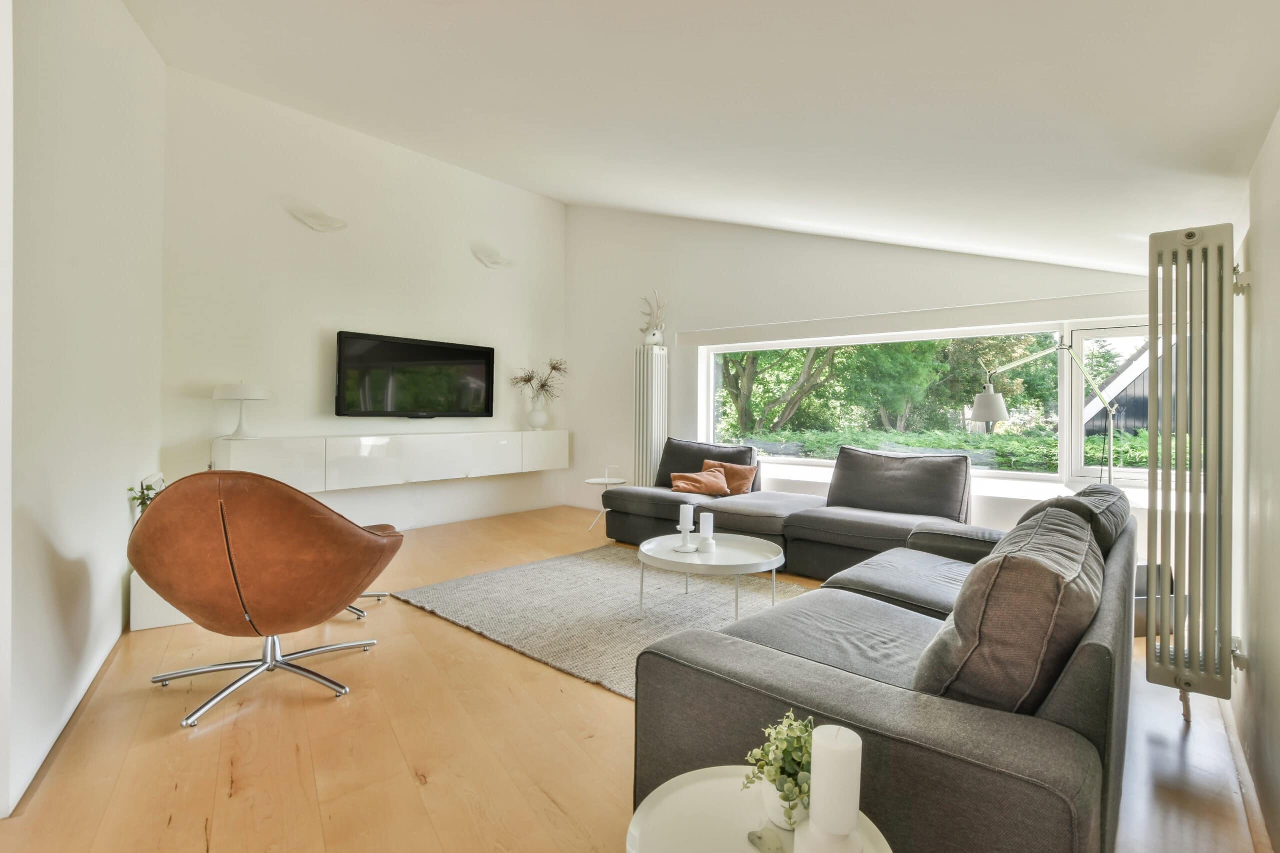 Modern dining area with balcony access in remodeled home