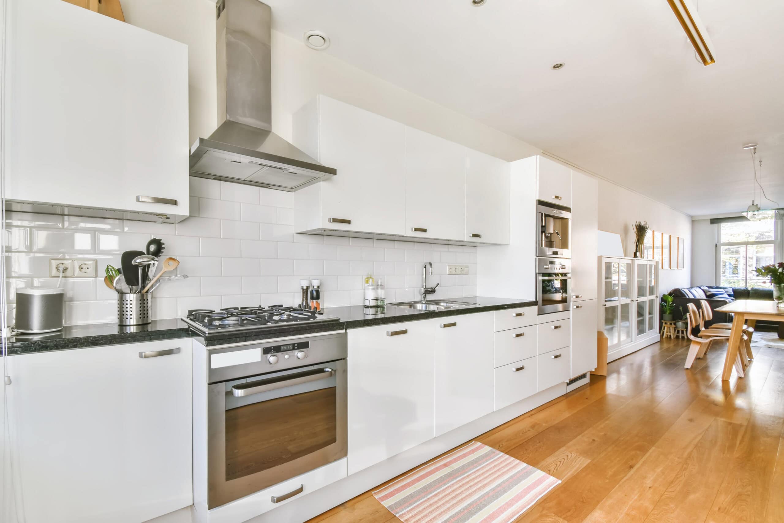 Luxury kitchen remodel with parquet flooring and custom cabinetry