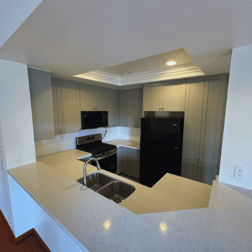 Irvine kitchen upgrade with new cabinets, appliances, and countertops by Tixan Construction. Expert.