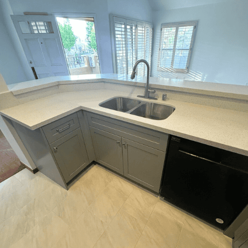 New Irvine kitchen renovation with gray cabinets and updated countertops.