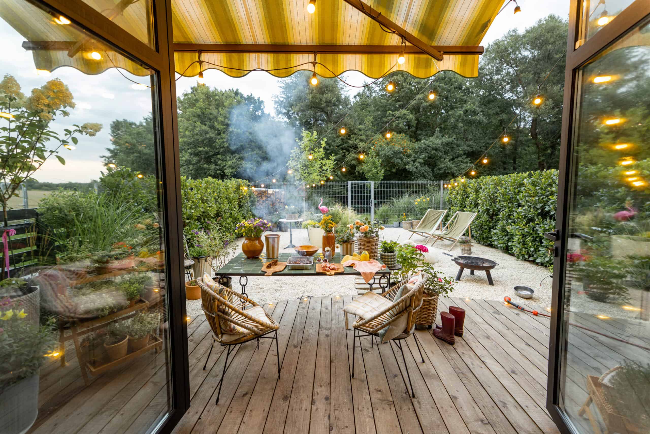 Outdoor patio in Newport Beach with comfortable seating and ambient string lights.